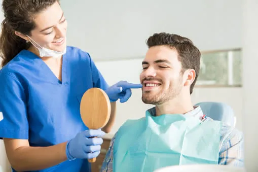 Dental patient in chair during porcelain crown procedure