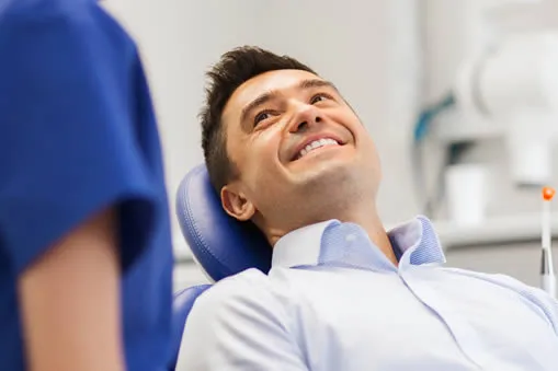 Man at dentist during new patient exam