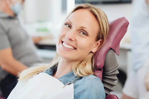 Woman smiling in dental chair during dental appointment
