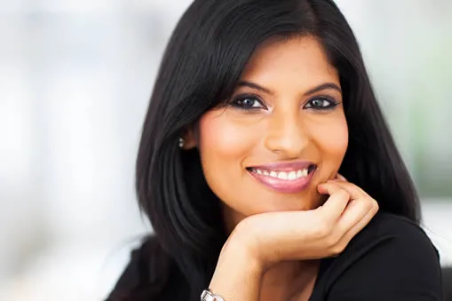 Woman with a beautiful smile showcasing porcelain dental work